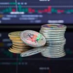 Close-up of cryptocurrency coins with a market graph background.